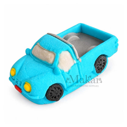 Blue 3D fondant pickup truck cake decoration with detailed wheels and open truck bed