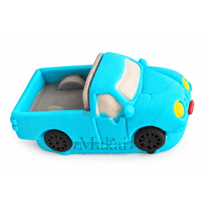 Blue fondant pickup truck cake decoration showing detailed wheels and side profile