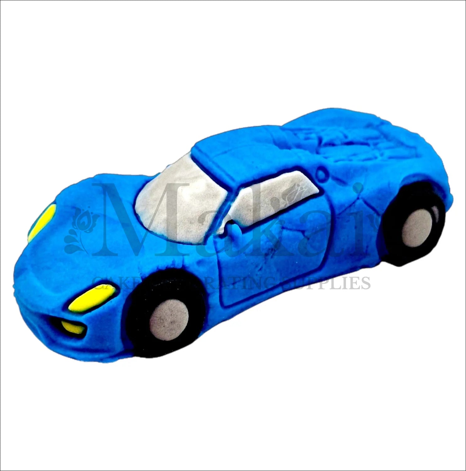 Edible electric‑blue fondant sports car cake topper with black wheels and yellow headlights.