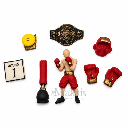 Red boxing themed fondant cake decoration set with boxer gloves, belt and accessories