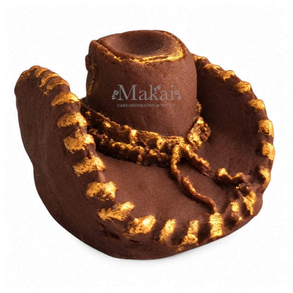 Brown 3D fondant cowboy hat cake decoration with gold detailing