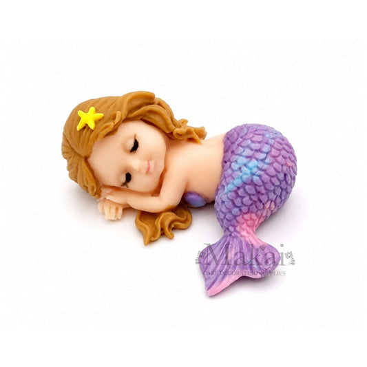 Edible sleeping mermaid baby cake topper with marble purple tail and brown hair, perfect for ocean and fantasy-themed cakes.