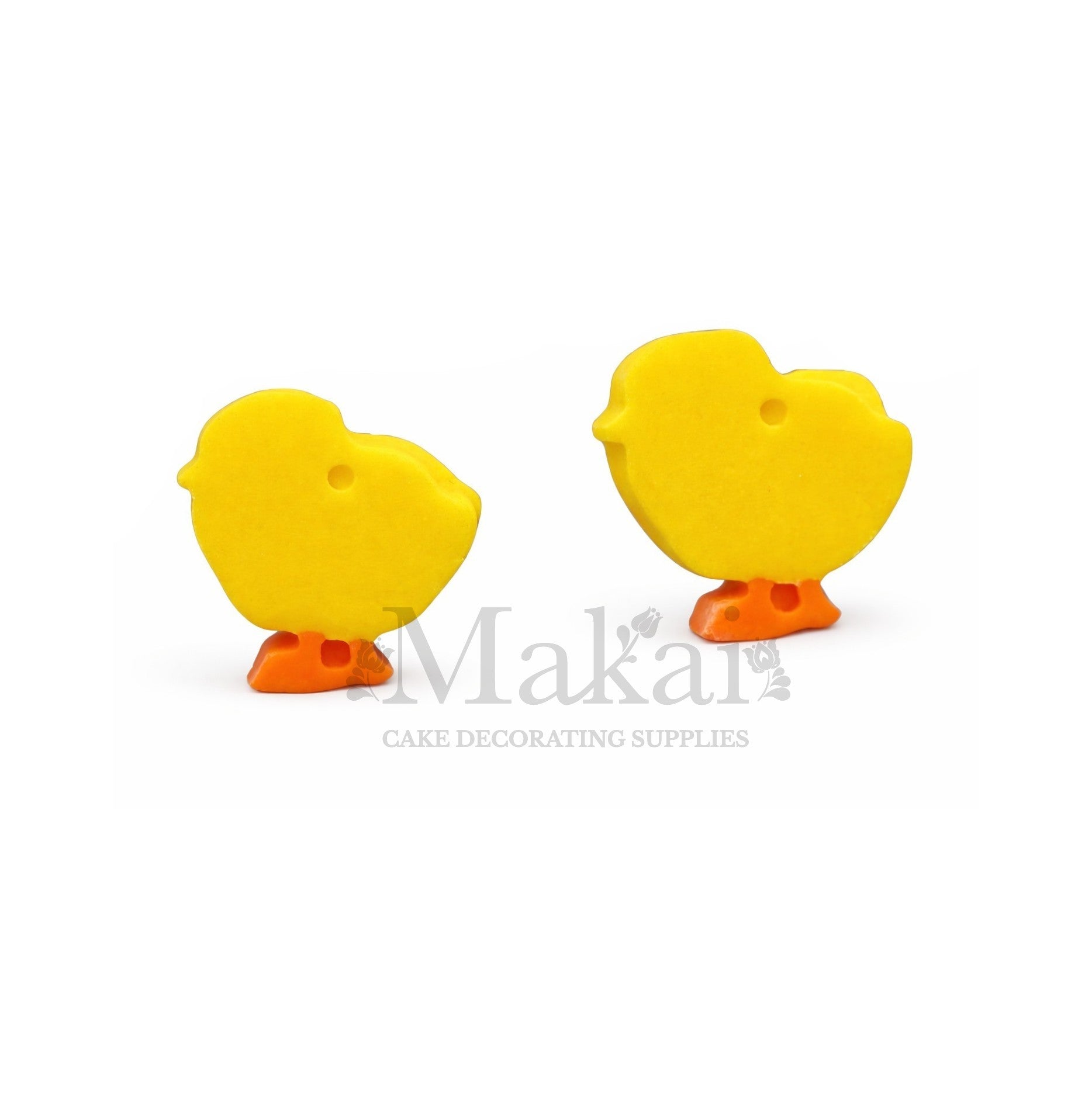 Two yellow duck-shaped cake decorations with orange feet on a white background, branded 'Makai'.