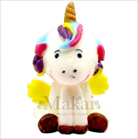 Cute unicorn cake topper with rainbow mane, golden horn, and yellow wings.