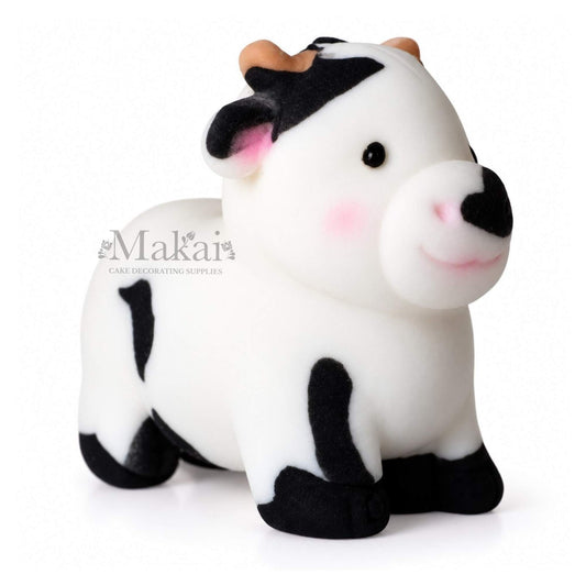 Large black and white cow fondant cake topper for farm themed birthday cakes