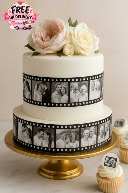 Elegant two-tier anniversary cake with white fondant, decorated with edible photo film strips and blush roses, displayed on a gold stand with matching cupcakes.