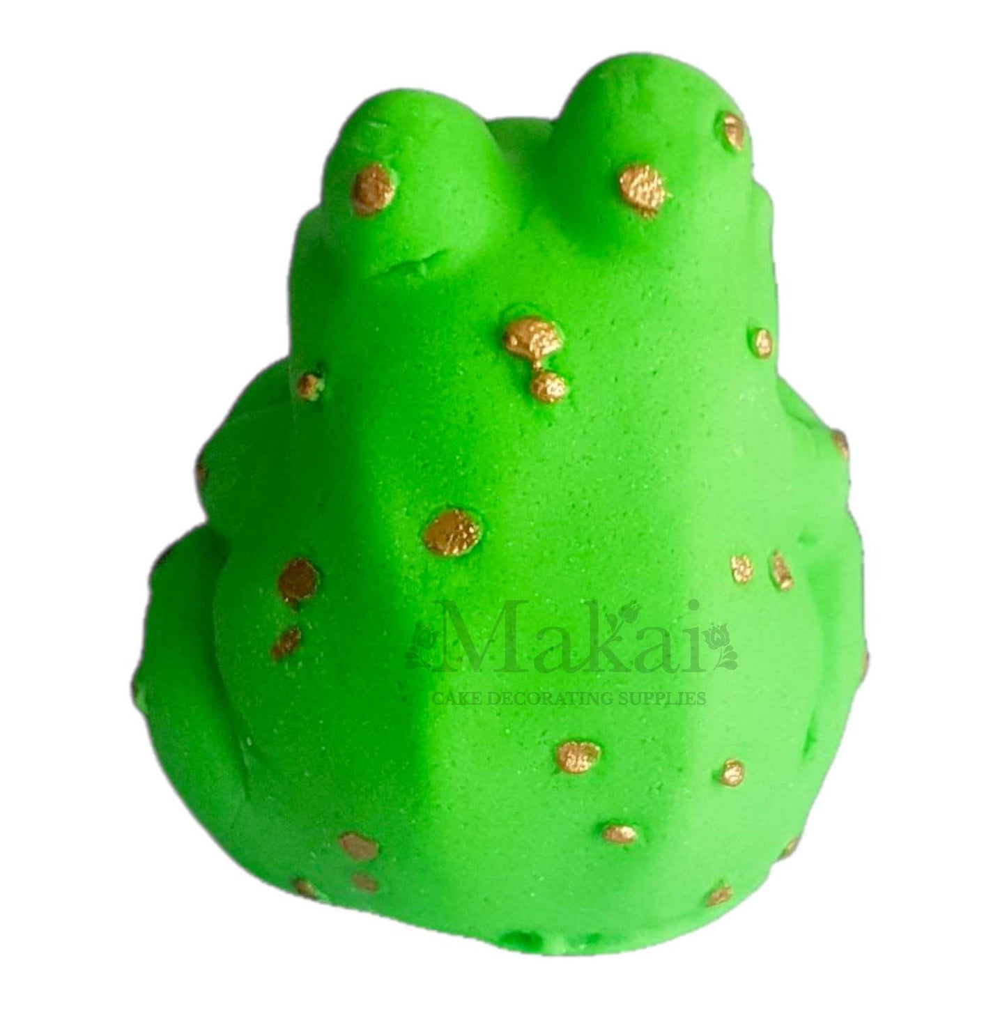 Back view of green fondant frog cake decoration with gold spots