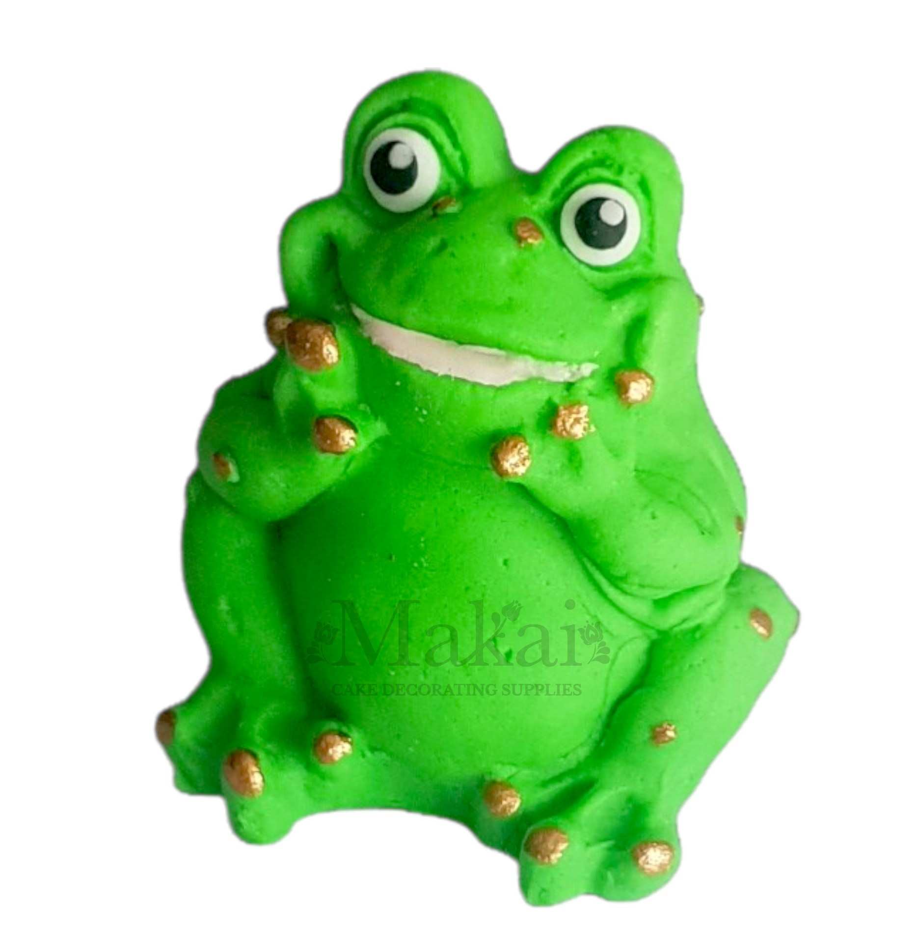 Cute green fondant frog cake topper with gold spots angled view