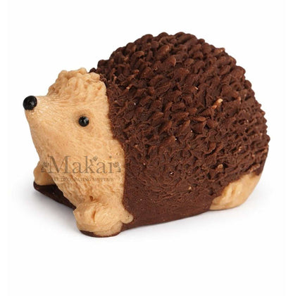 Fondant hedgehog cake topper in cream and dark brown colours