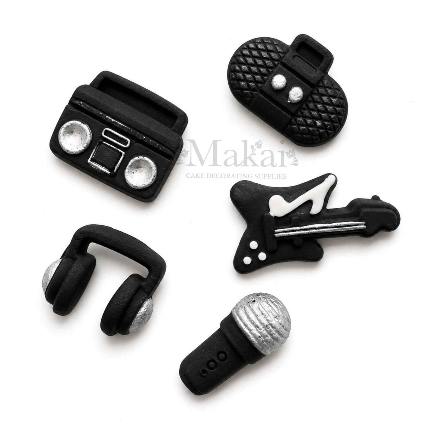 Black and silver fondant music cake decorations with guitar microphone headphones and radios