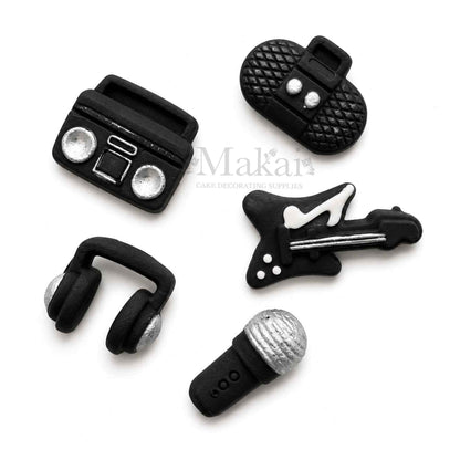 Black and silver fondant music cake decorations with guitar microphone headphones and radios