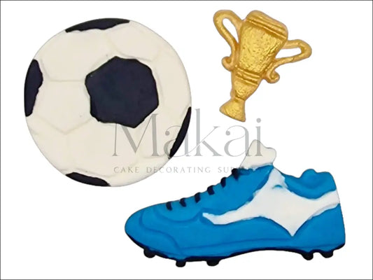A football-themed cake decoration set featuring a large fondant football, a blue football boot, and a gold trophy, perfect for sports-themed cakes.
