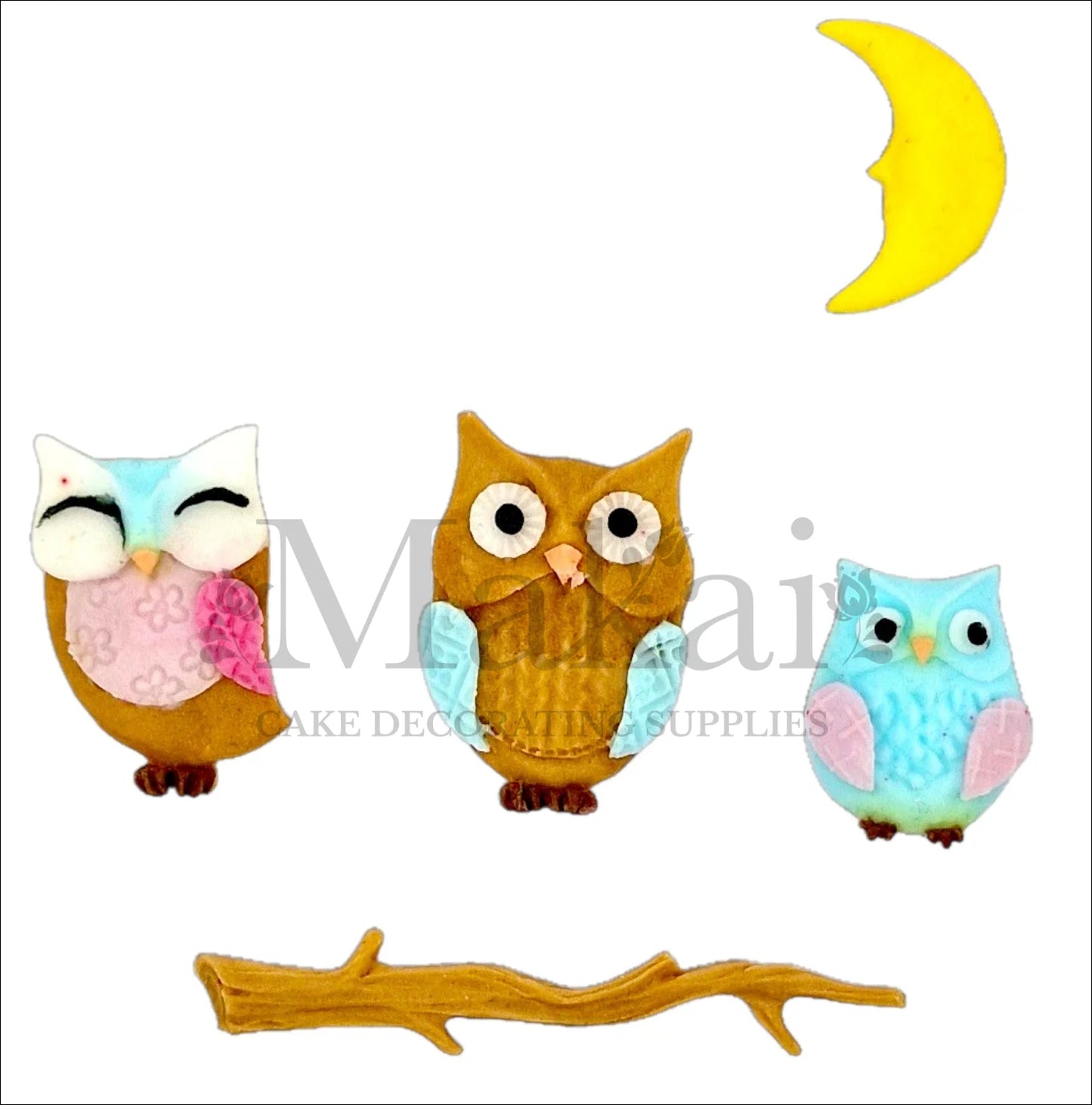 Edible cake topper set with three owls, a yellow crescent moon, and a brown tree branch – ideal for forest or woodland-themed cakes.