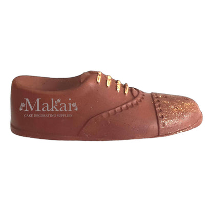 Brown gentleman shoe fondant cake topper with gold details, side view, elegant men’s cake decoration