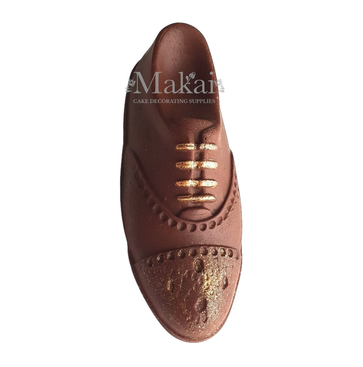Edible gentleman shoe cake topper made from chocolate brown fondant with gold painted details, top view
