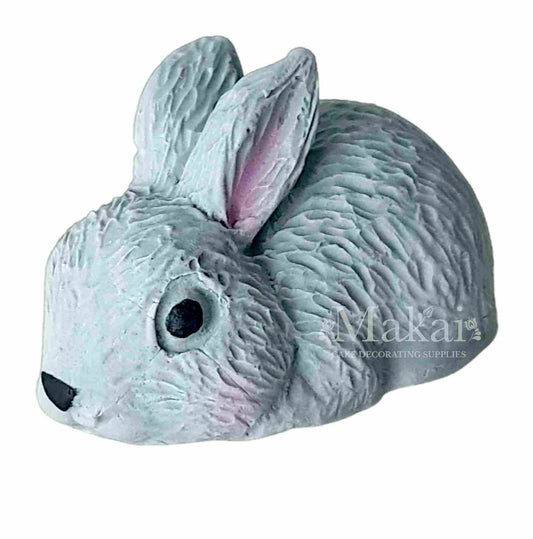 Grey rabbit cake topper decoration on a white background