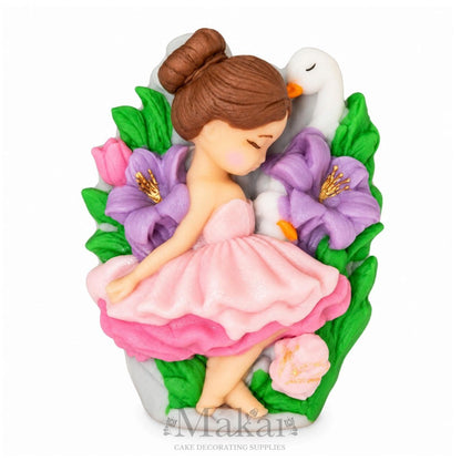 Handmade ballerina fondant cake topper with pink dress, white swans, purple flowers and green leaves for girls birthday cakes.