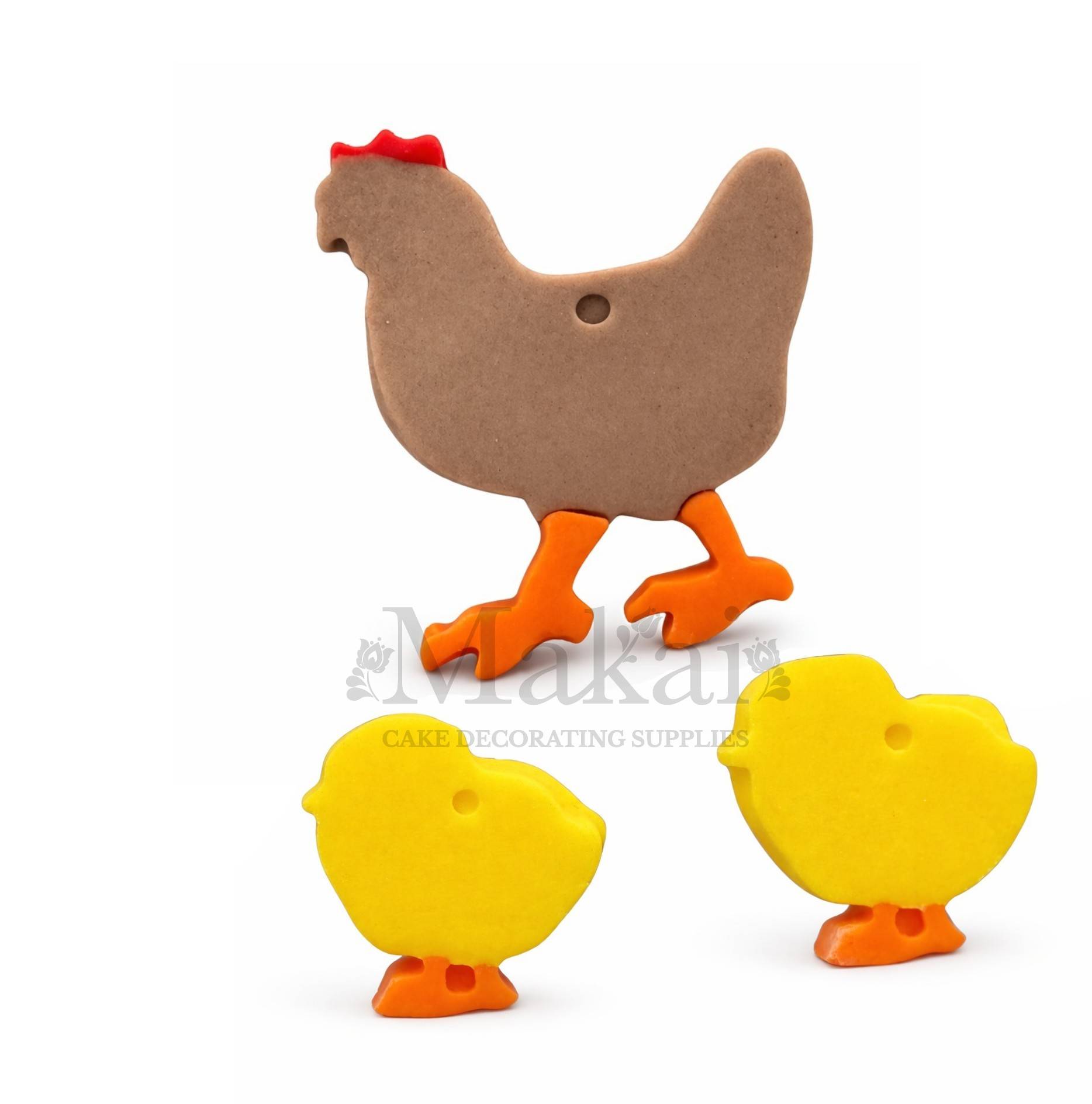 Two chicken-shaped cake decorations, one brown and one yellow, on a white background.
