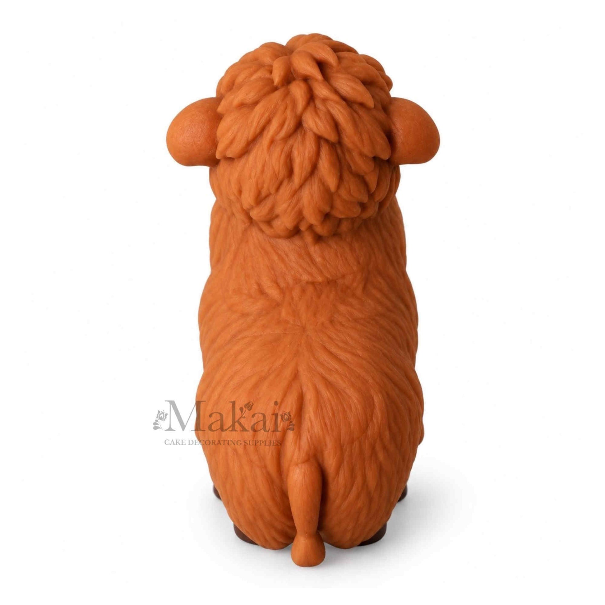 Large Highland cow fondant cake topper with brown textured fur for farm themed cakes. Top View