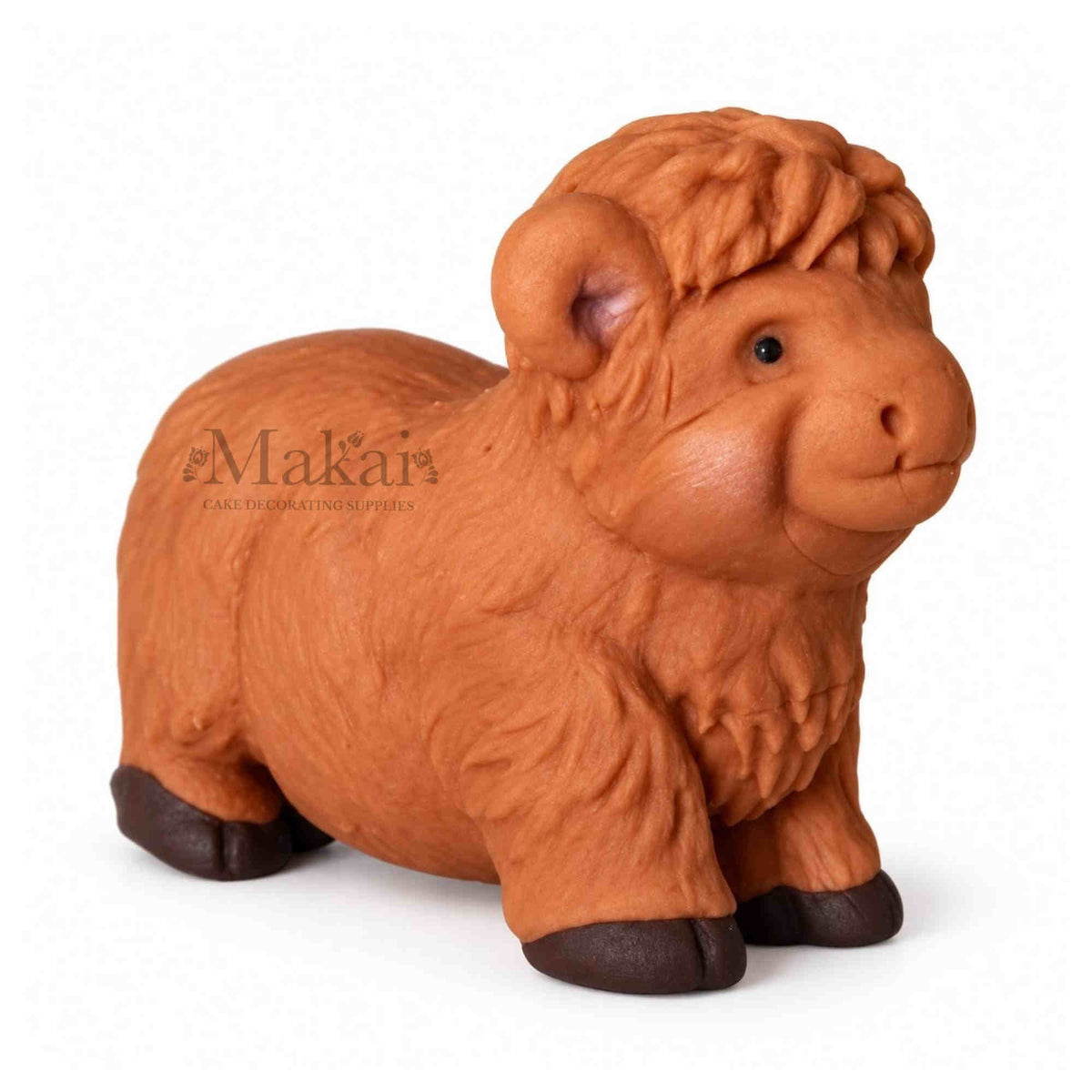 Large Highland cow fondant cake topper with brown textured fur for farm themed cakes. Side view