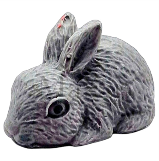 Realistic large grey rabbit cake topper lying down.