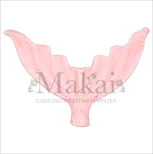 Large baby pink edible mermaid tail cake topper, perfect for ocean and fantasy cake decorations.