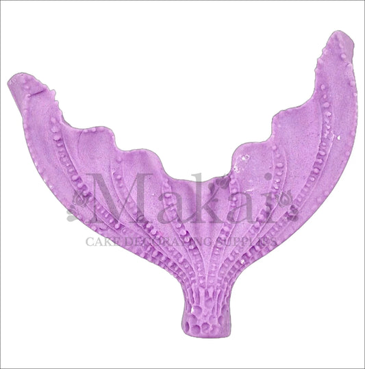Large edible purple mermaid tail cake topper with textured design, perfect for ocean and fantasy-themed cakes.