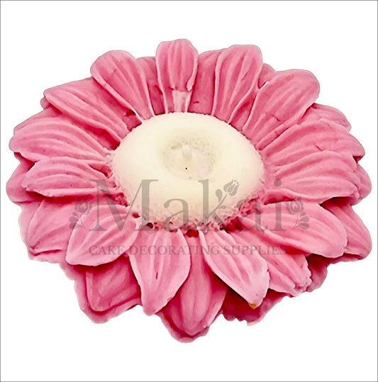 Large pink gerbera flower cake topper with detailed petals.