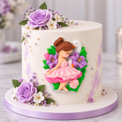 Elegant Lavender Ballerina Cake: Elegant white birthday cake with a ballerina and swan fondant topper, decorated with lavender roses, delicate flowers and pearls.