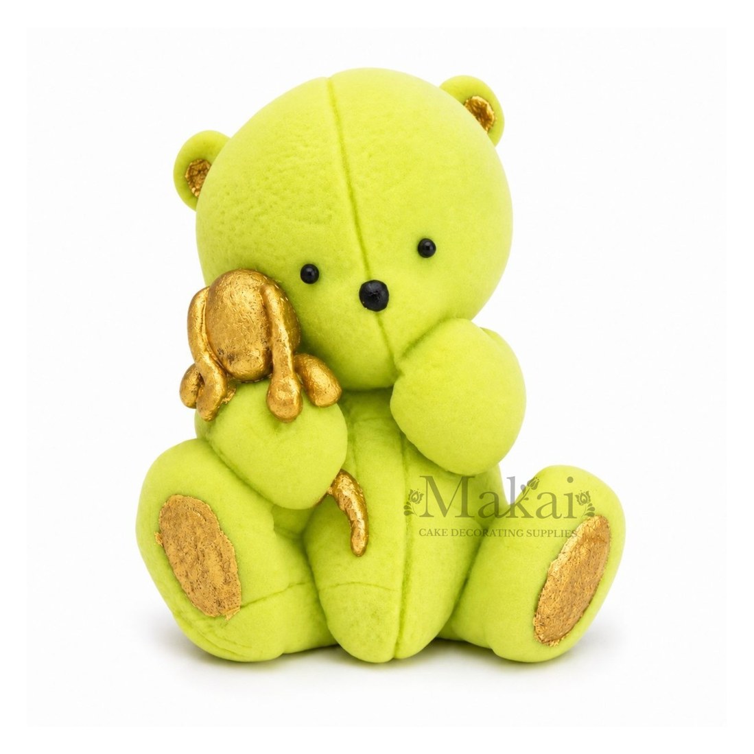 Light Green teddy bear fondant cake topper holding a gold bunny decoration, front view