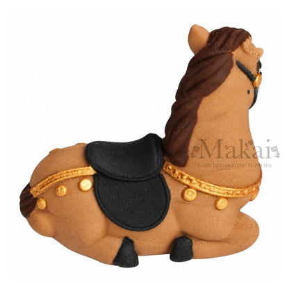 Handmade fondant horse cake decoration with black saddle and gold detailing, shown from the opposite side.
