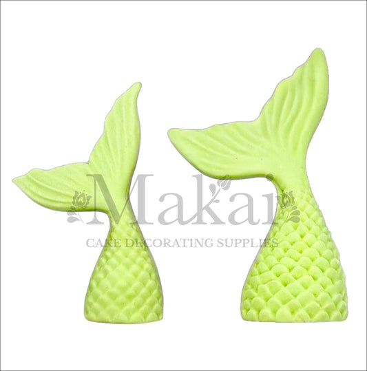Set of two light green edible mermaid tail cake toppers for ocean and fantasy cake themes.