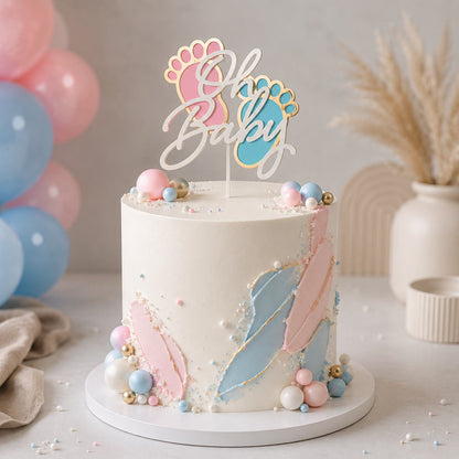 Baby shower cake with decorative elements and 'Oh Baby' topper