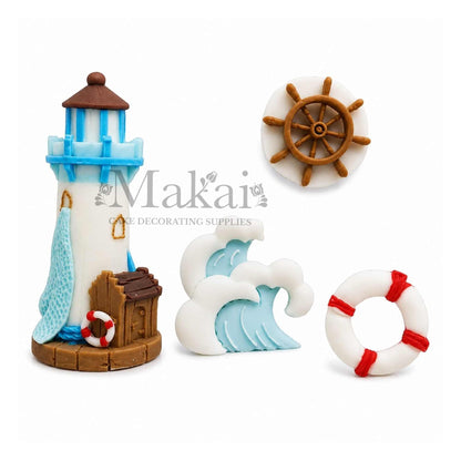 Handmade nautical fondant cake decorations with lighthouse, ship wheel, ocean wave and lifebuoy for seaside themed cakes