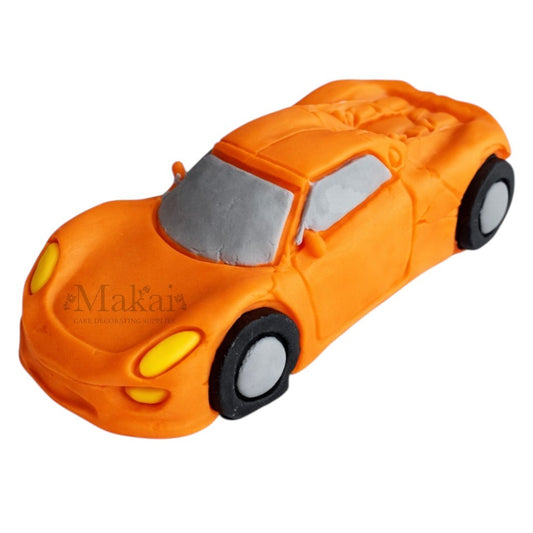 orange sports car fondant cake decoration for boys birthday cake