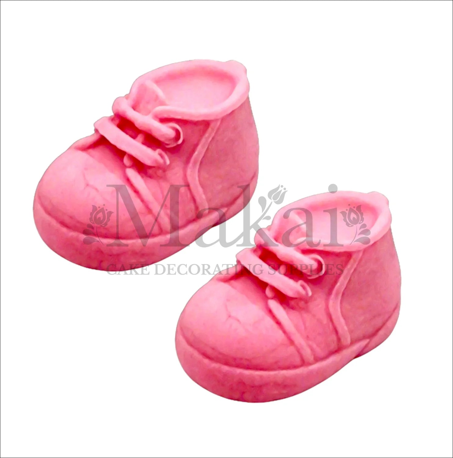 Edible fondant pink baby shoes cake topper set for girl baby‑shower and birthday cakes.