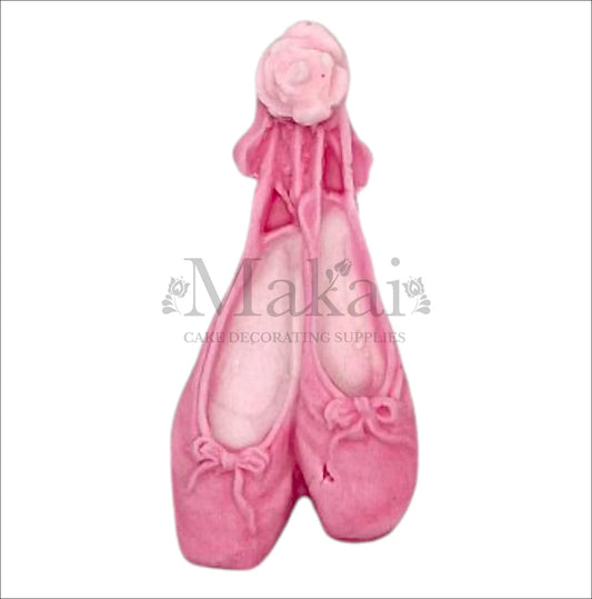 Pink ballerina shoe cake topper with ribbons for baby‑girl and dance‑themed cakes.