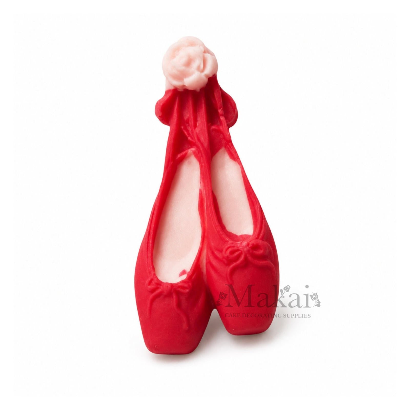 Pink ballerina shoe cake topper with ribbons for baby‑girl and dance‑themed cakes.