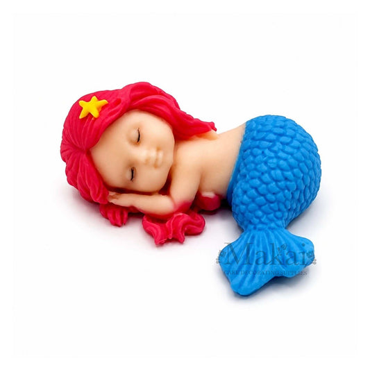 Sleeping mermaid baby edible cake topper with blue tail and pink hair, perfect for ocean and fantasy-themed cakes.