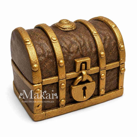 Edible pirate treasure chest cake topper with gold details — ideal for nautical or adventure-themed cakes.