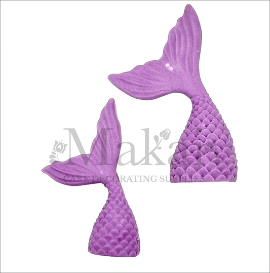 Set of two edible purple mermaid tail cake toppers with textured scales, ideal for fantasy and ocean-themed cakes.