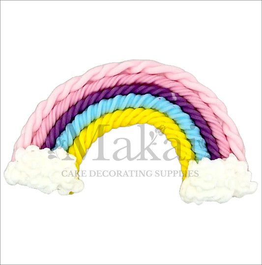 Edible pastel rainbow with clouds cake topper in yellow, blue, purple, and pink colours.