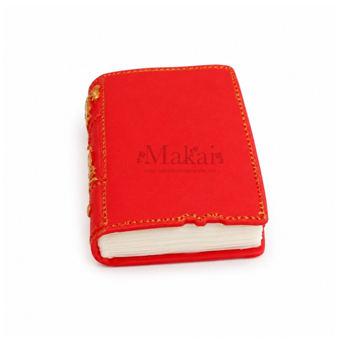 Red edible fantasy book cake topper with gold decorative details - bottom view