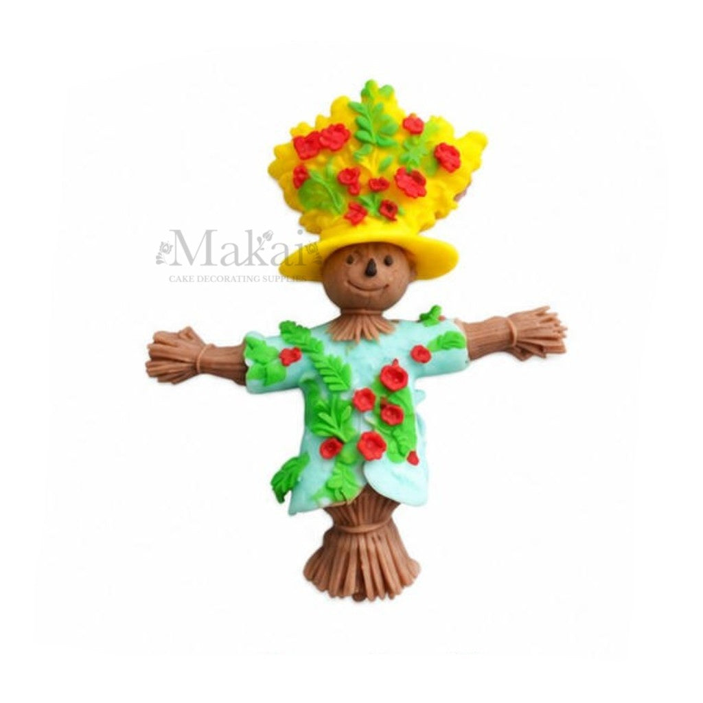 Colourful fondant scarecrow flat-back cake decoration with floral hat and flowers