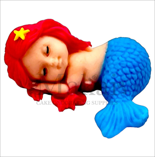 Sleeping mermaid baby edible cake topper with blue tail and pink hair, perfect for ocean and fantasy-themed cakes.