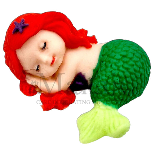 Sleeping mermaid baby edible cake topper with green tail and red hair, ideal for fantasy and ocean-themed cakes.
