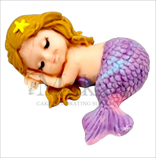 Edible sleeping mermaid baby cake topper with marble purple tail and brown hair, perfect for ocean and fantasy-themed cakes.