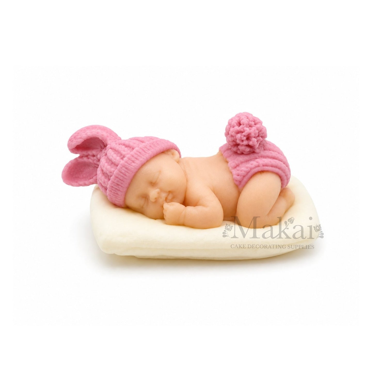 Sleeping baby girl fondant cake topper with pink bunny hat on white cushion