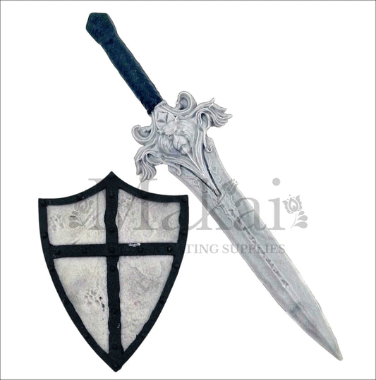 Edible sword and shield fondant cake toppers in medieval style for fantasy and adventure-themed cakes.