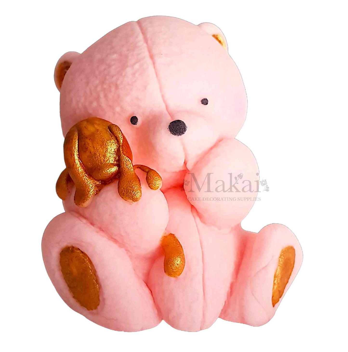 Pink teddy bear holding a small gold bunny, cake topper decoration on a white background